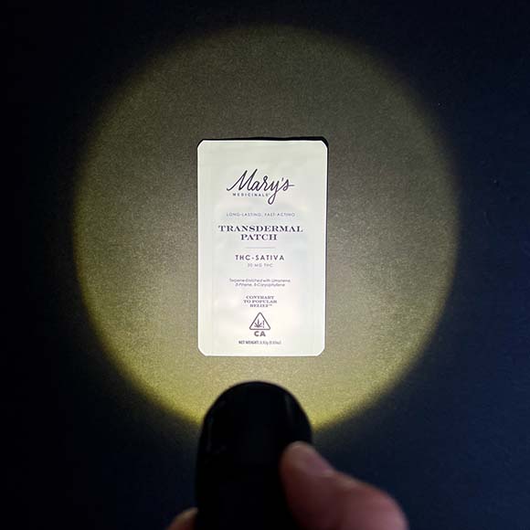 Mary's Medicinals Transdermal Patch Mary's Medicinals Transdermal Patch being illuminated with a flashlight