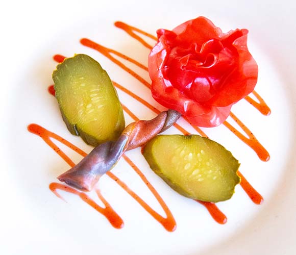 Fruit leather Rose Fruit leather Rose on a plate with pickle leaves