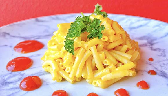 Kraft mac and cheese with ketchup Kraft mac and cheese on a place circled with ketchup dots